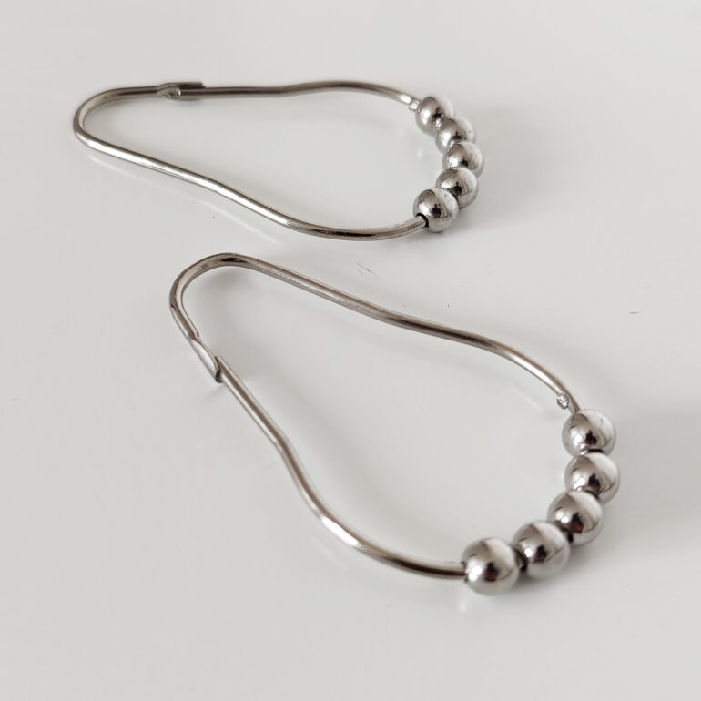 ganchos anillos para cortina de baño con bolitas rodamientos deslizantes de barral. diseño Muett